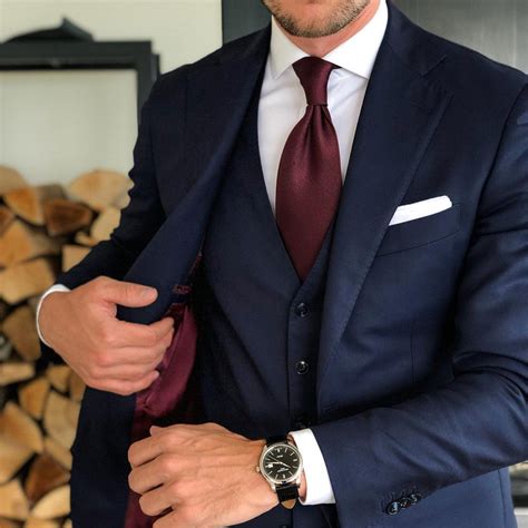 blue suit burgundy tie.